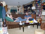 Larissa and Rob relax on the couch.